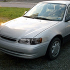 1998-2000 Toyota Corolla Factory Style Crystal Headlights w/ Corner Lights & Bulbs (Matte Black Housing / Clear Lens)