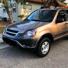 2002-2004 Honda CR-V Factory Style Headlights with Amber Reflector (Matte Black Housing / Clear Lens)