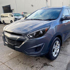 2010-2013 Hyundai Tucson Projector Headlights w/ LED Light Strip (Matte Black Housing/Clear Lens)