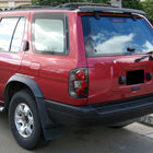 1996-2004 Nisssan Pathfinder/ Infiniti QX4 Tail Lights (Matte Black Housing/Clear Lens)